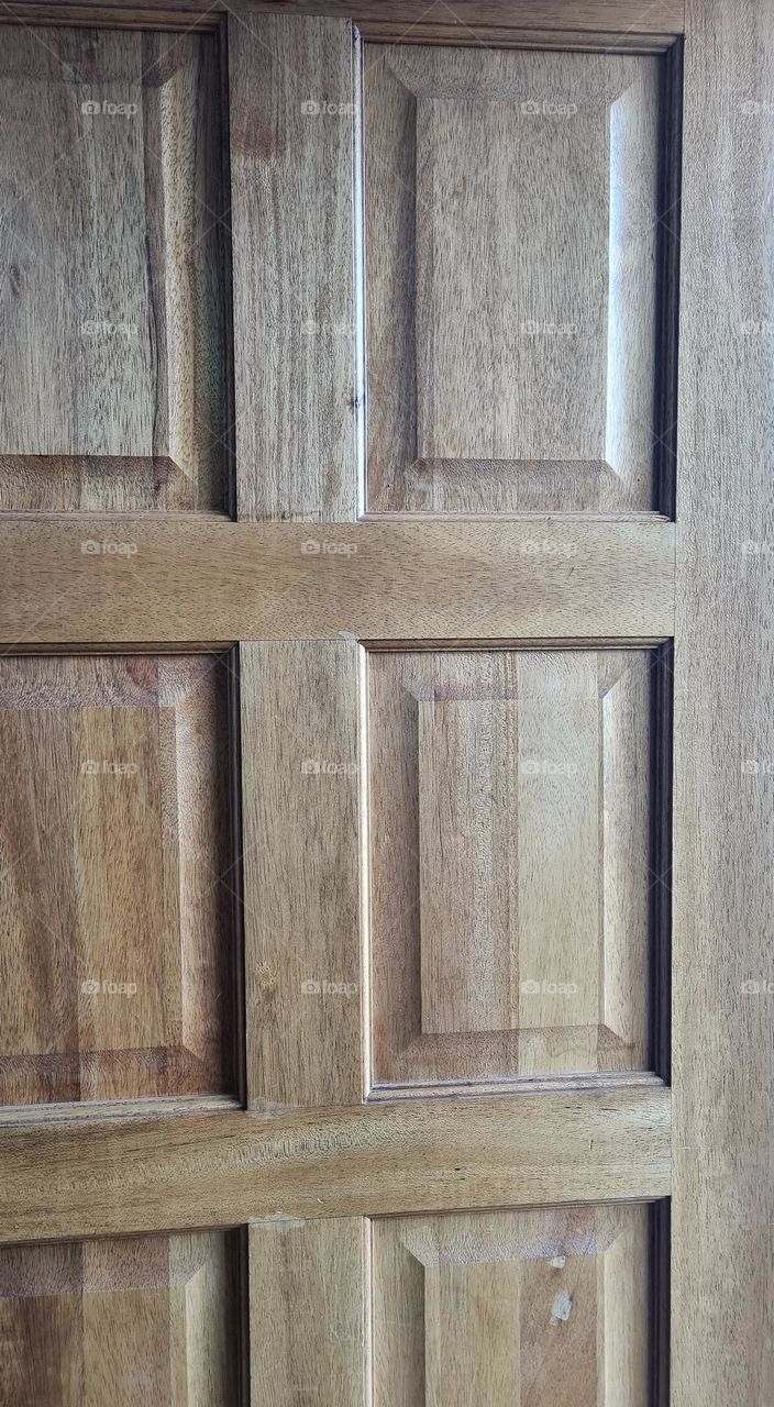 rectangular shapes in a wooden door.