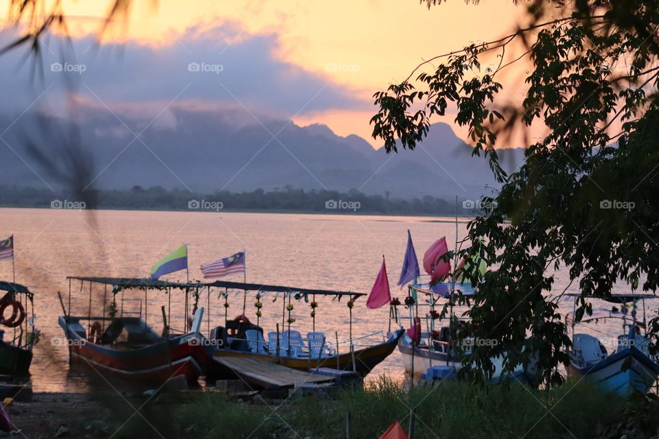 Beautiful scenery of a boating area at the sunset