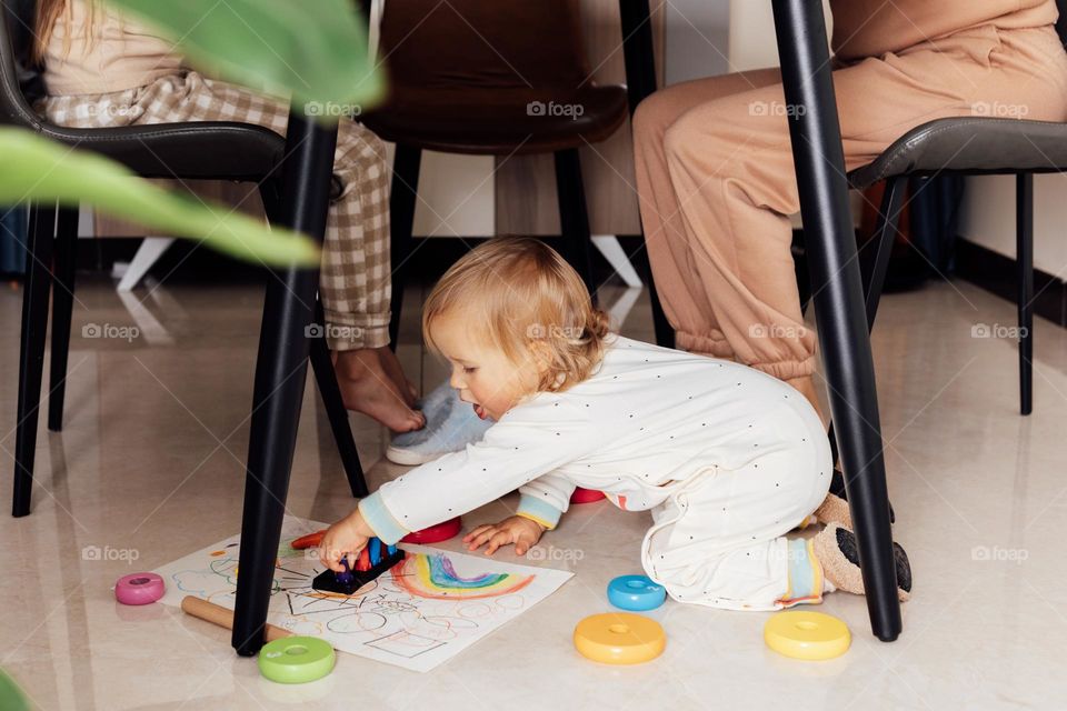 Baby playing on floor at home 