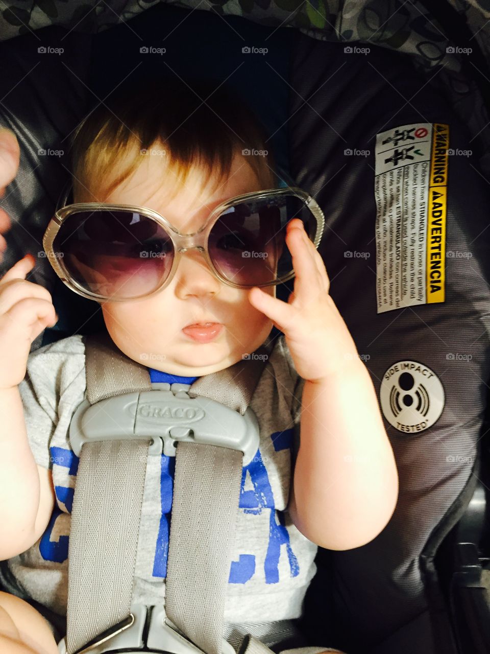 Attitude. Wearing mummy's oversized sunglasses is so silly! We love to play while daddy drives 