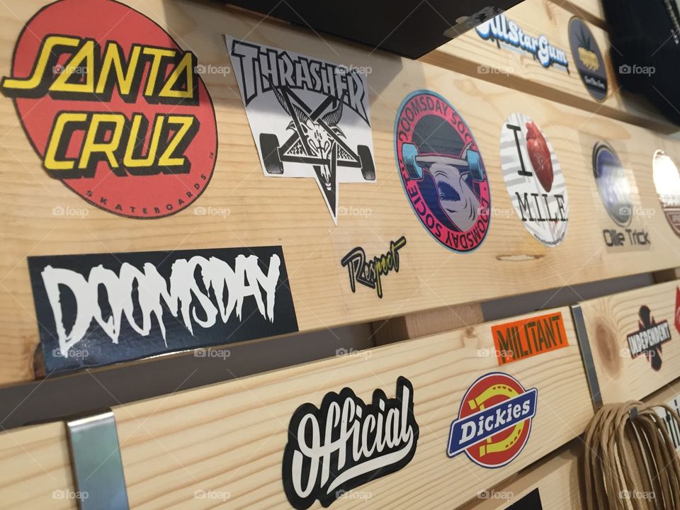 Brands stick on the wooden wall in the store 