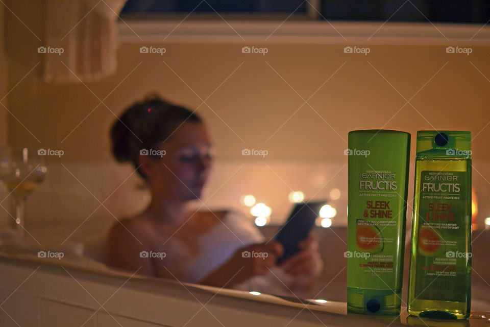 Garnier Fructis shampoo and conditioner and a girl reading 