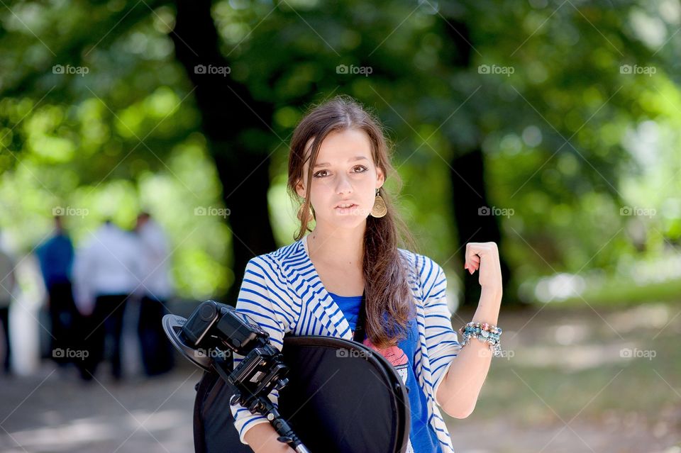 Portrait of a girl holding camera