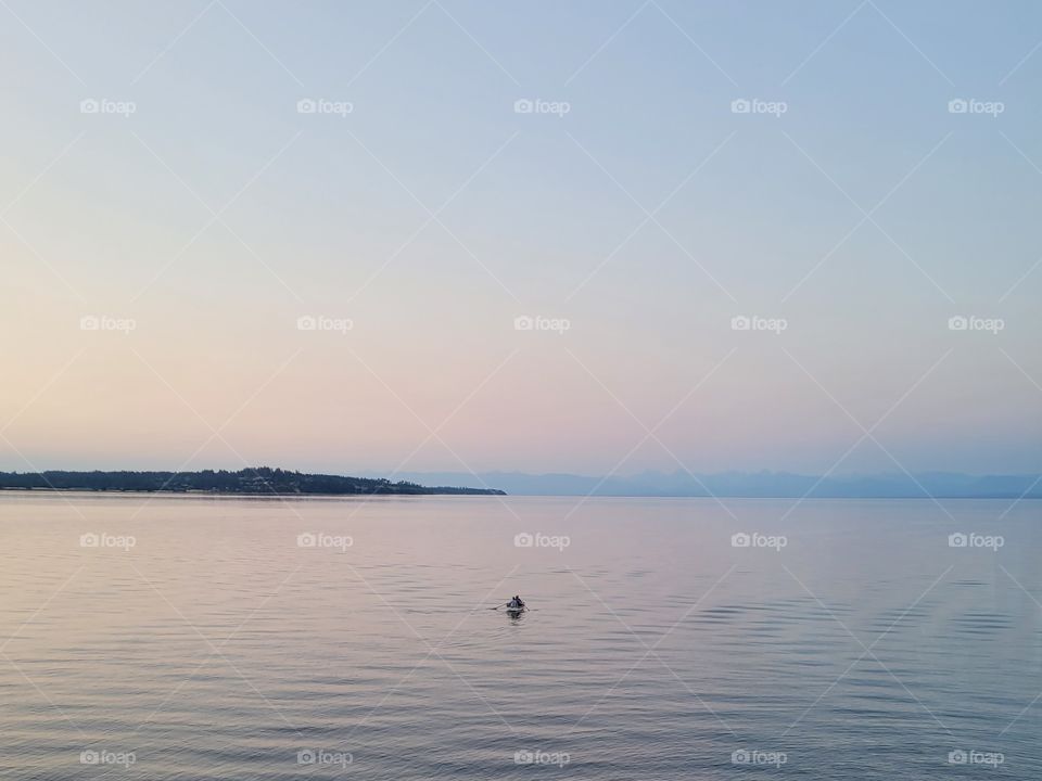 Couple Boating at Beach Sunset