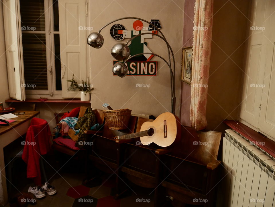 Messy living room with guitar 