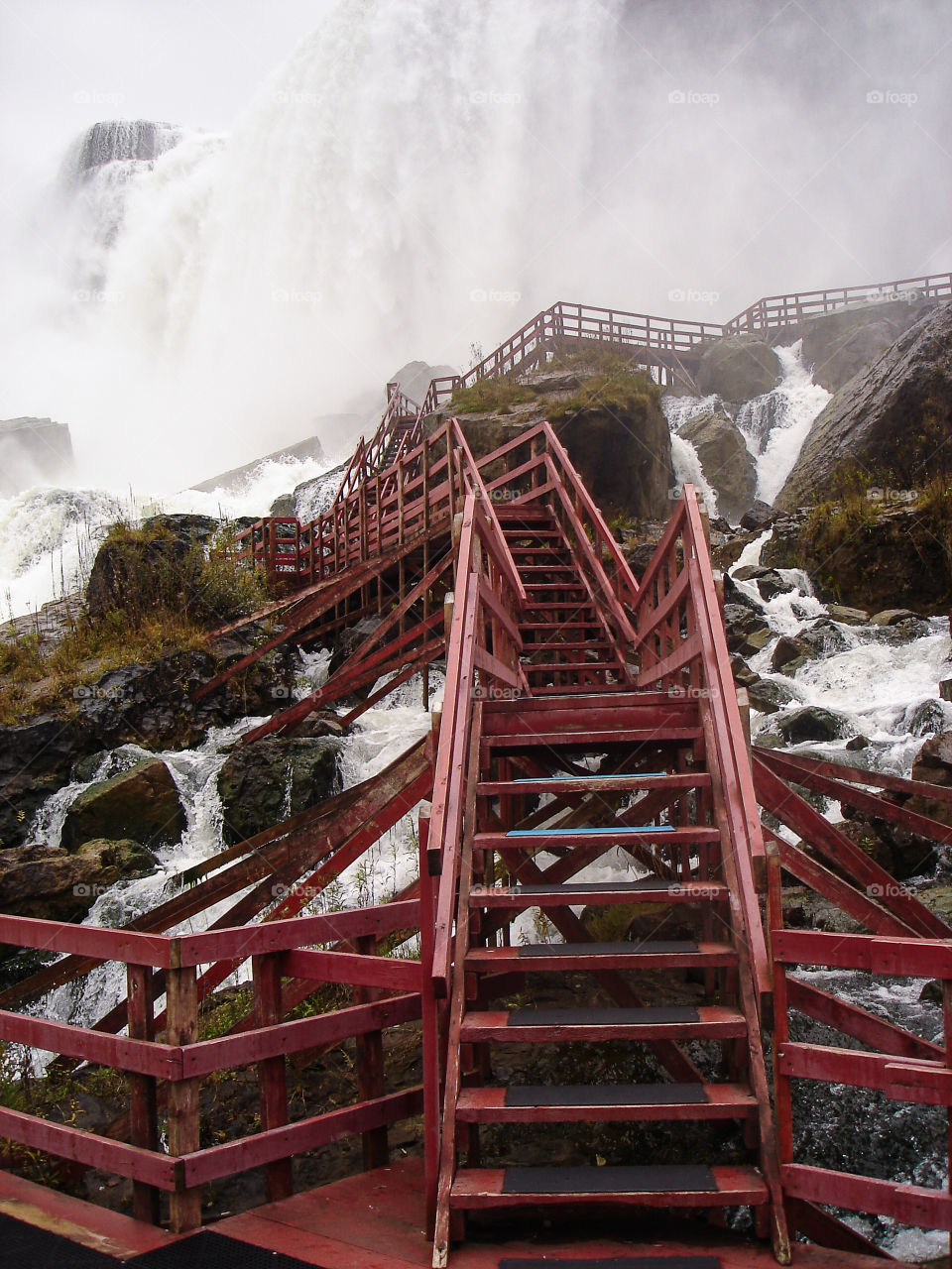 Red stairs below the Niagara Falls . Best view to the falls is from below