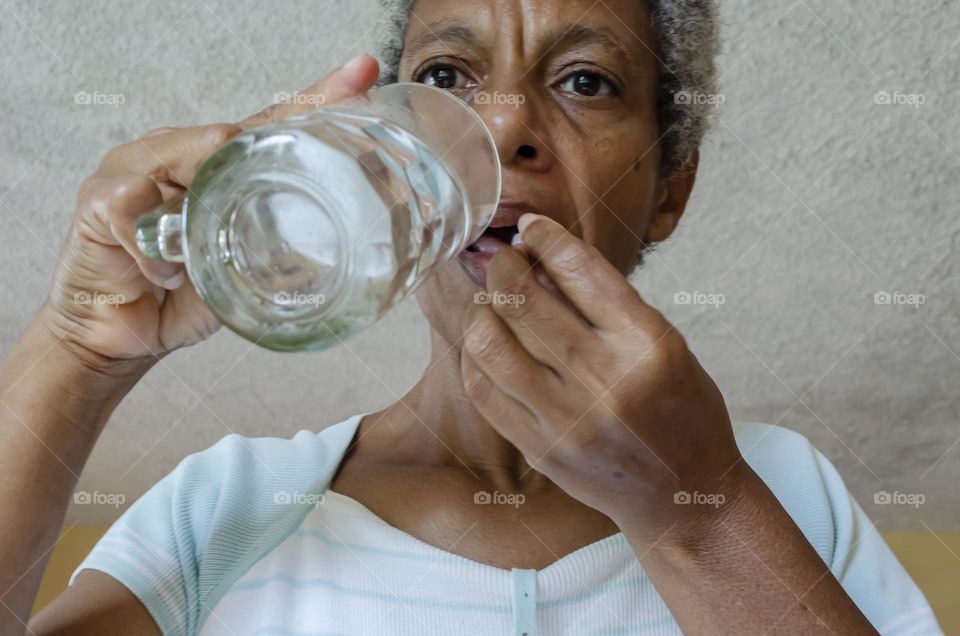 Woman Taking A Tablet