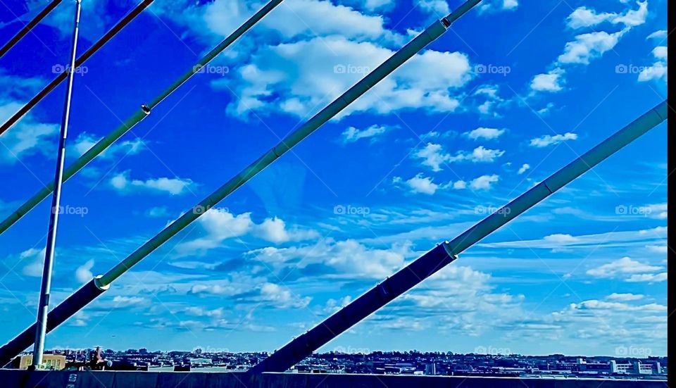 The “Kosciuszku Bridge”, held together by cable ties looks like two monumental triangular tents on either side of the “BQE”, the expressway connecting Queens & Bklyn w the bridge support being the pole. 2022. Hypnotic Productions