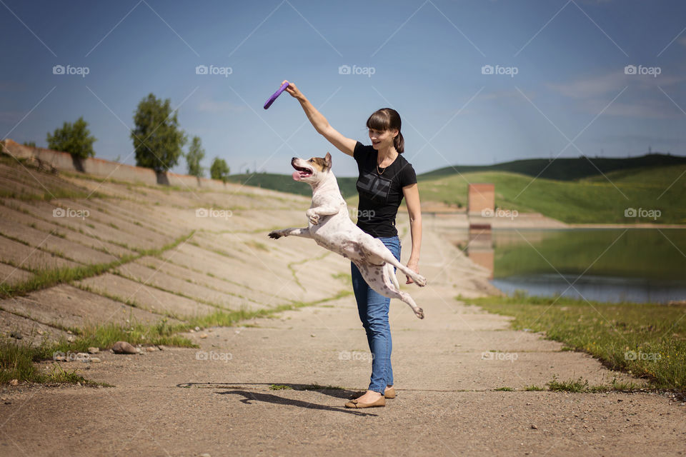 Woman playing with dog