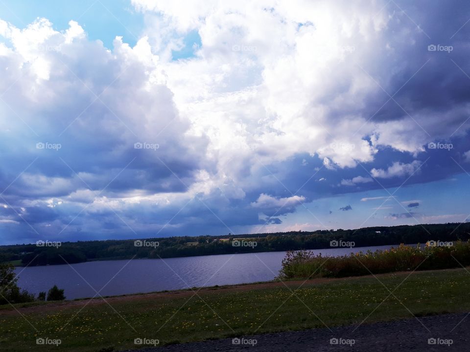 storm clouds forming over water