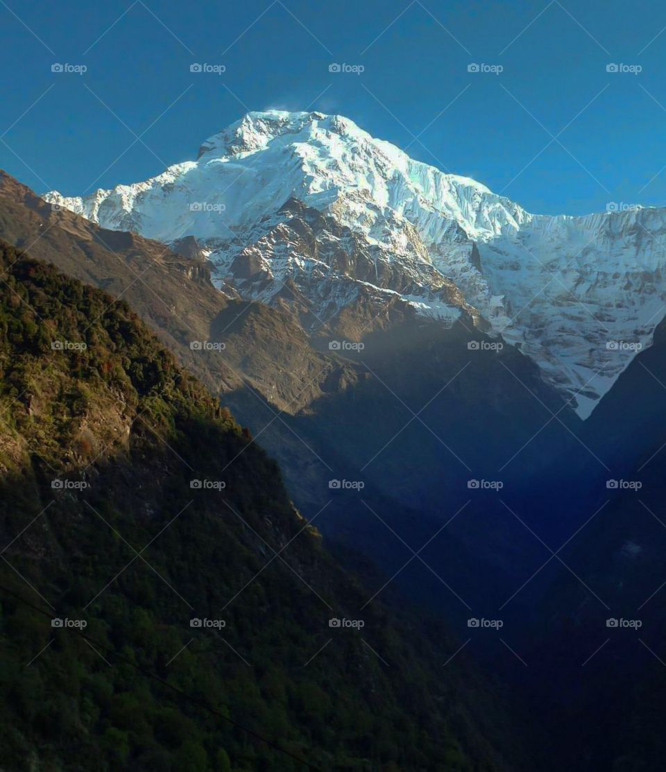 A stunning view of Annapurna South as seen from Chhomrong. Photo taken on the Annapurna Base Camp Trek in Nepal.