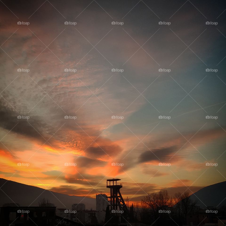 Scenic view of dramatic sky at sunset