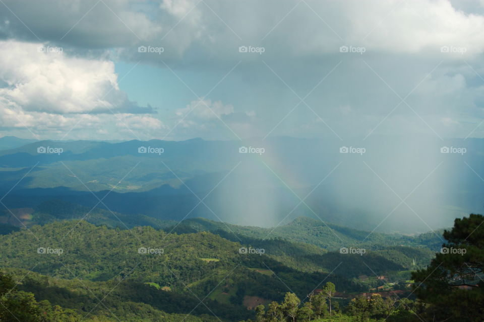 After the rain. Rainbow in nature.