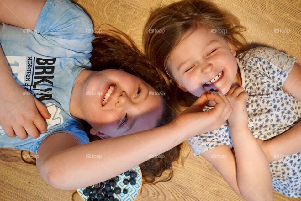 Sisters giggling on the floor ... lots of laughter and smiles 🤗