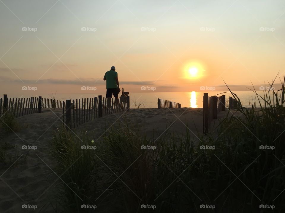 Sunrise walk on the beach with my dog. 