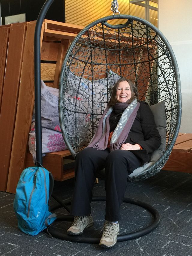 Woman sitting on bamboo swing