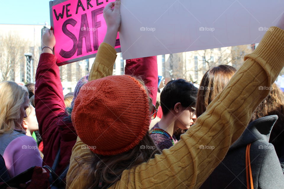 A woman holding a protest sign at the March For Our Lives in Washington, DC on March 24, 2018. 