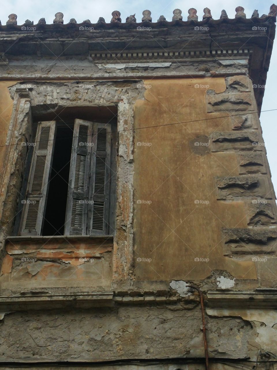 Low angle view of damaged house