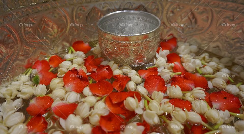 Jasmine and rose floating on water