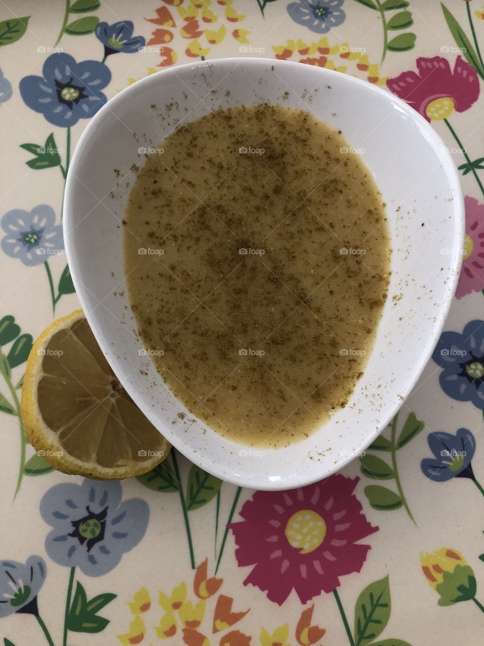 Yellow lentils soup with cumin and lemon
