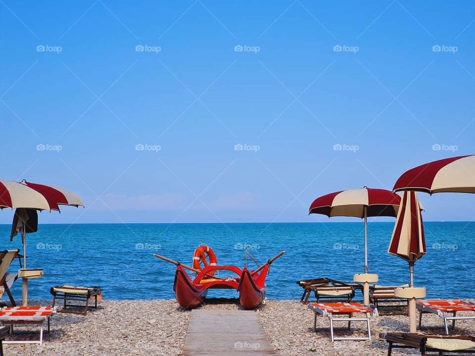 rescue boat and red sea umbrellas