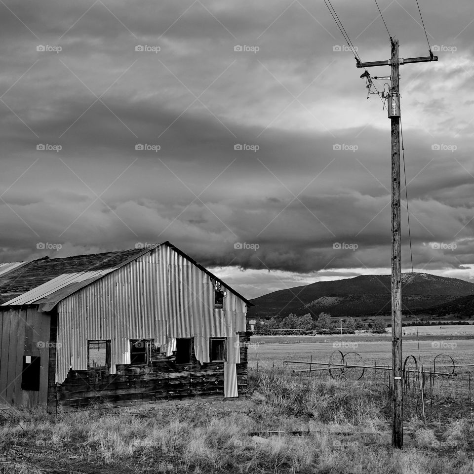 Damaged barn on field