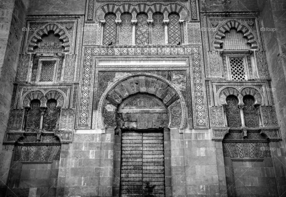 Mezquita Door. Black and white photo of arched door taken at the Mezquita mosque/cathedral in Córdoba, Spain.