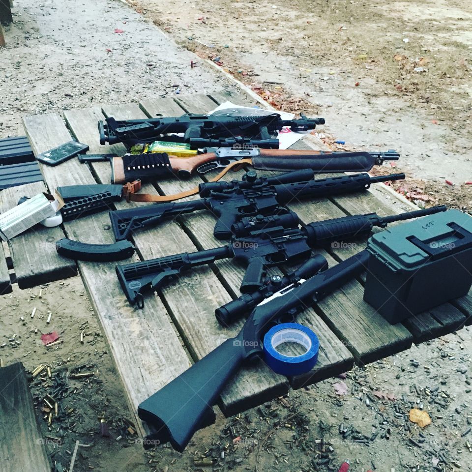 Rifles laid out on bench
