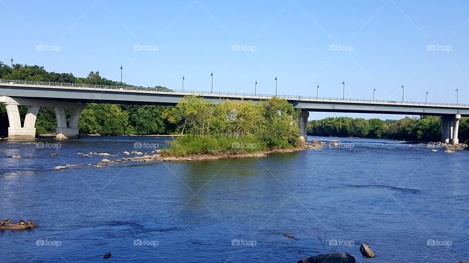 A Little River Island with a bridge in the back Mississippi River