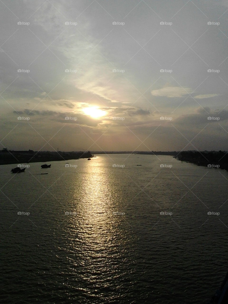 beautiful sunset at the middle of batanghari river