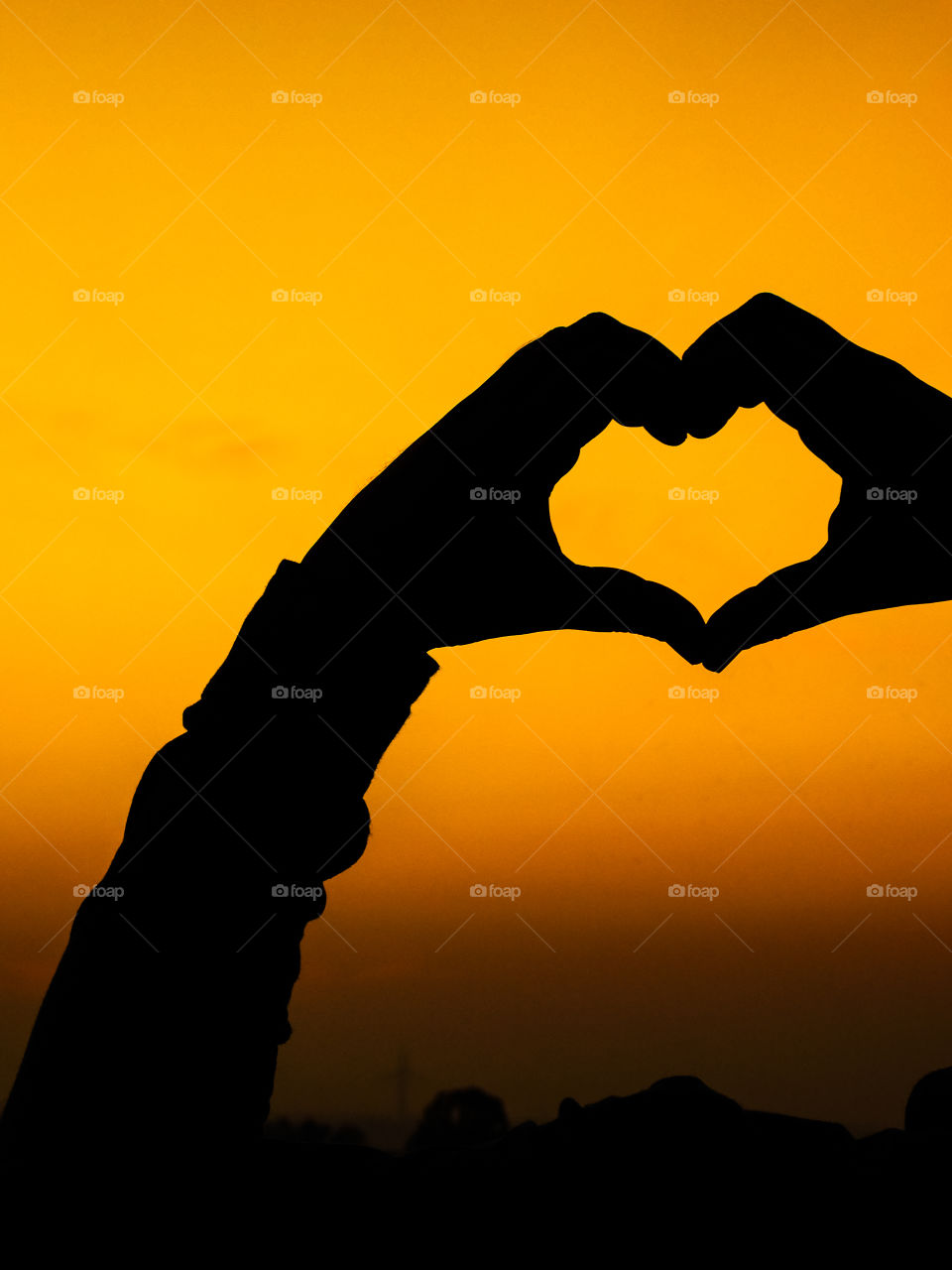 Love wallpaper or heart shaped hand posture with beautiful background .