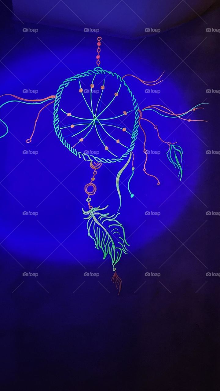 a painting of  glow Dreamcatcher on wall