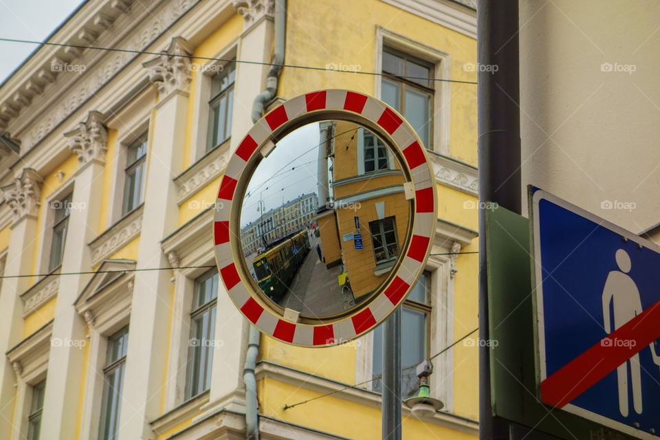 Tram in the traffic mirror