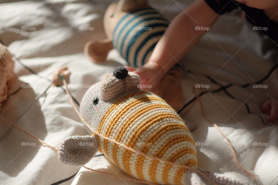 Two crochet toys in sunlights 