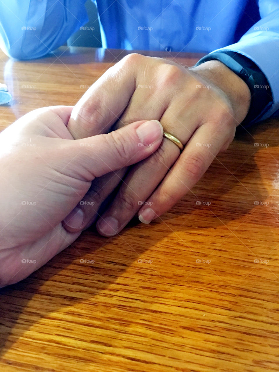 Close-up of couple holding hands