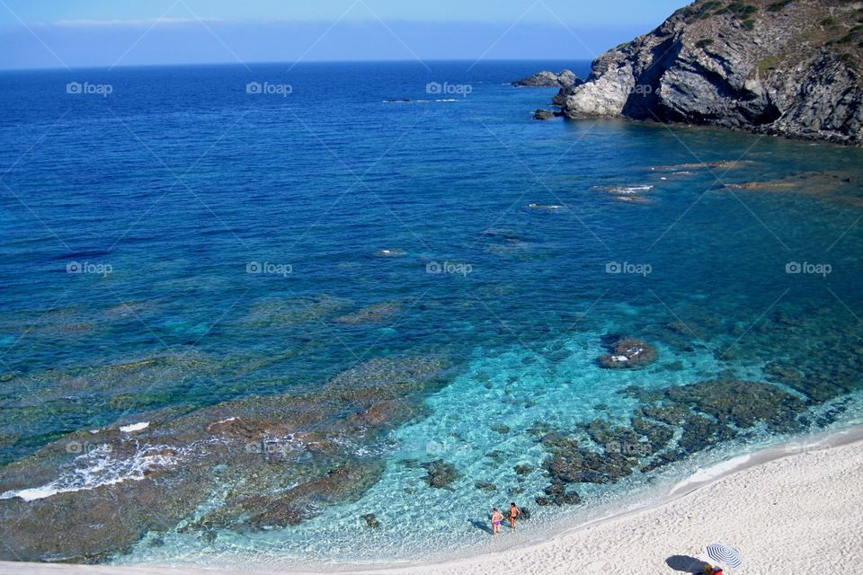 cliff And White Sandy beach in the mediterranean sea