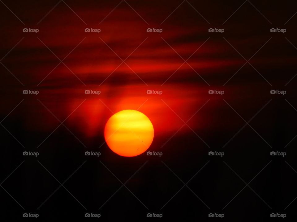 The Red and Yellow mixed Sun downs to the earth for sleep, a beautiful natural sunset landscape wallpaper