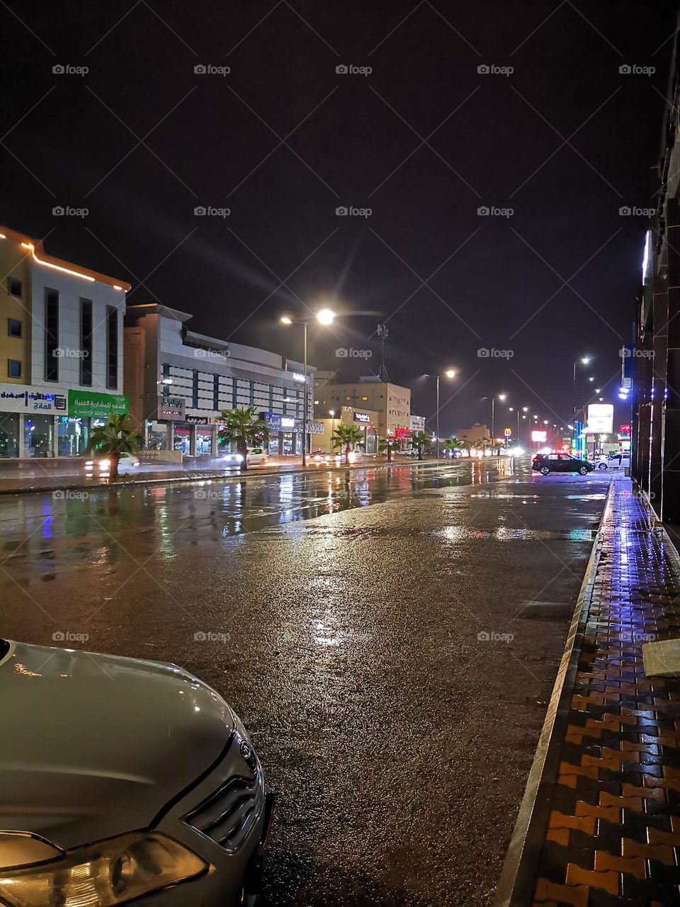 Dark windows at night in the city in time of rain