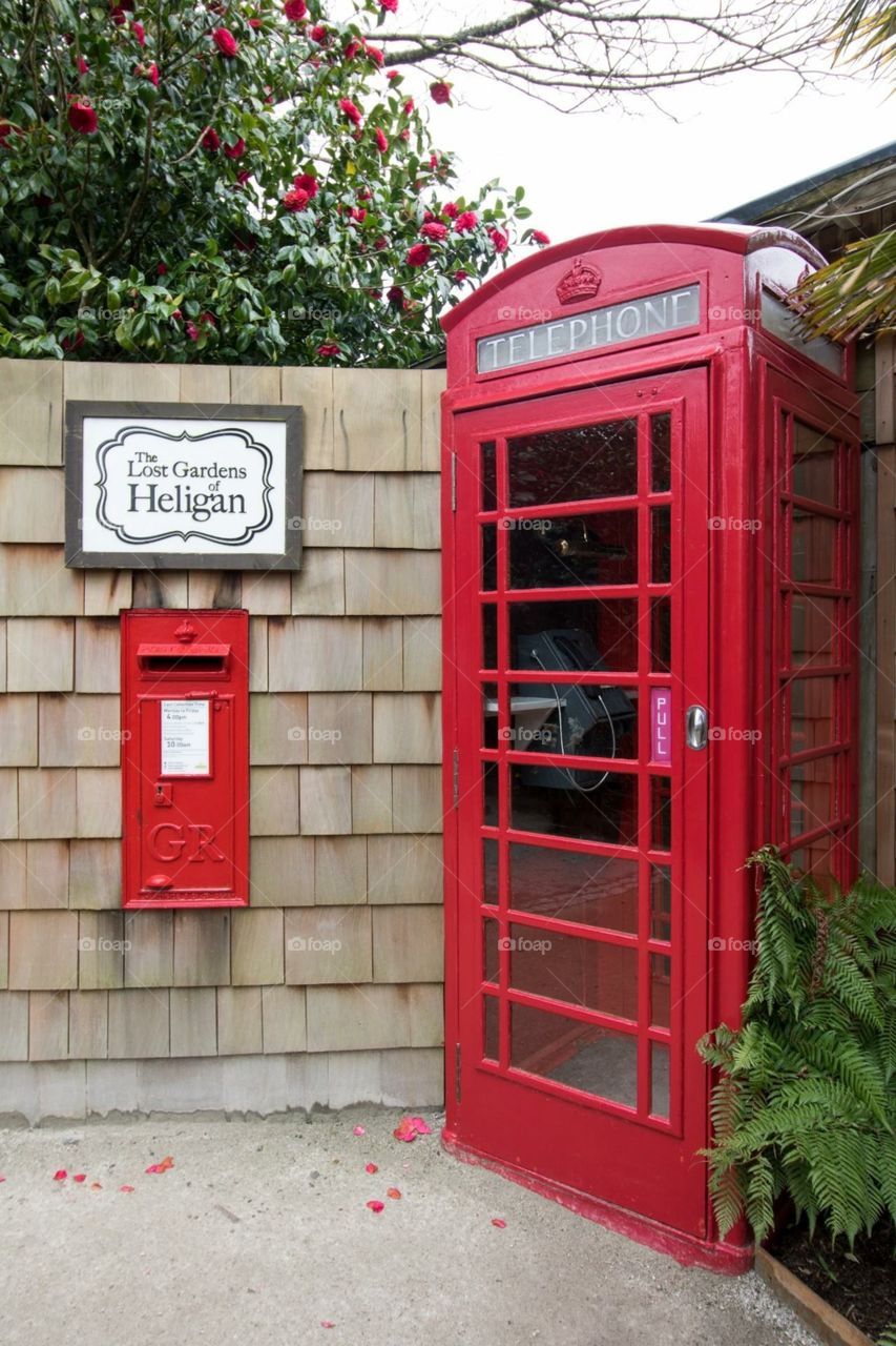 Traditional red phone box, Lost Gardens of Heligan, Cornwall, England, UK