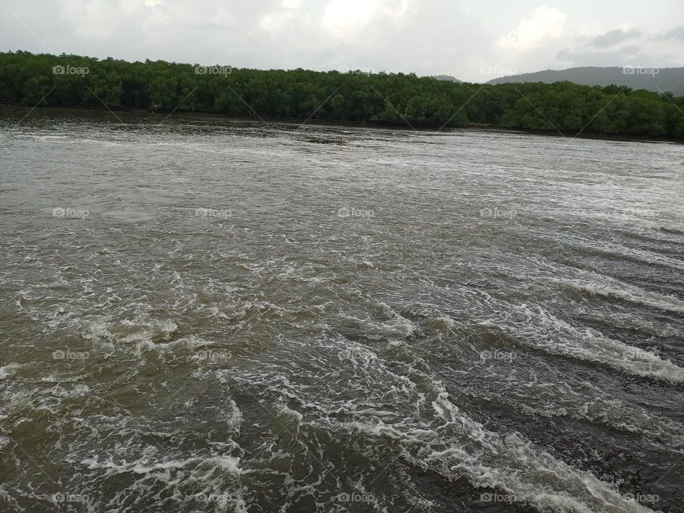 Beautiful lines of water flowing in river it's looking amazing beauty of nature water likes milk