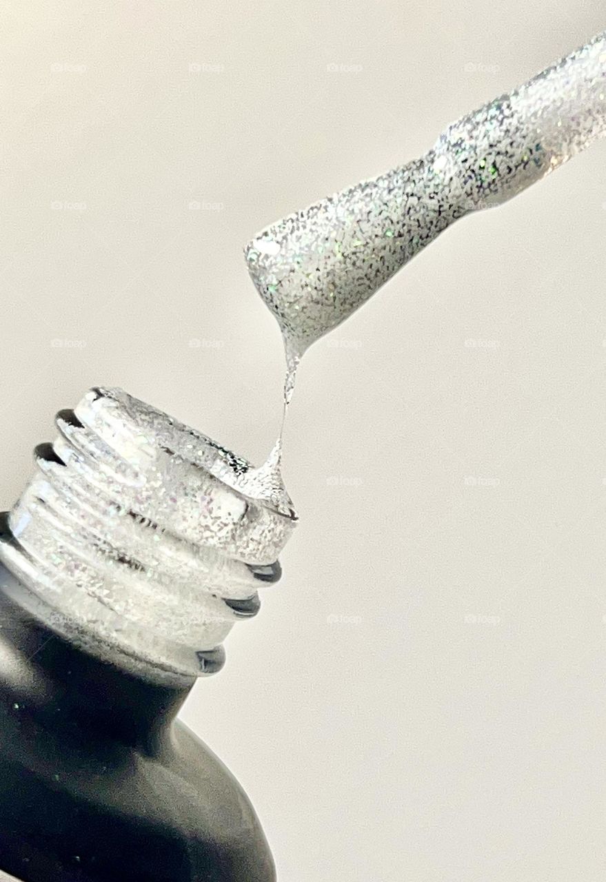 Semi-transparent delicate glitter nail polish