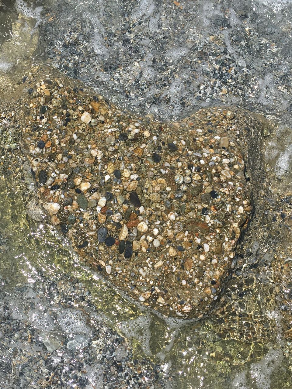 Love stone in the sea