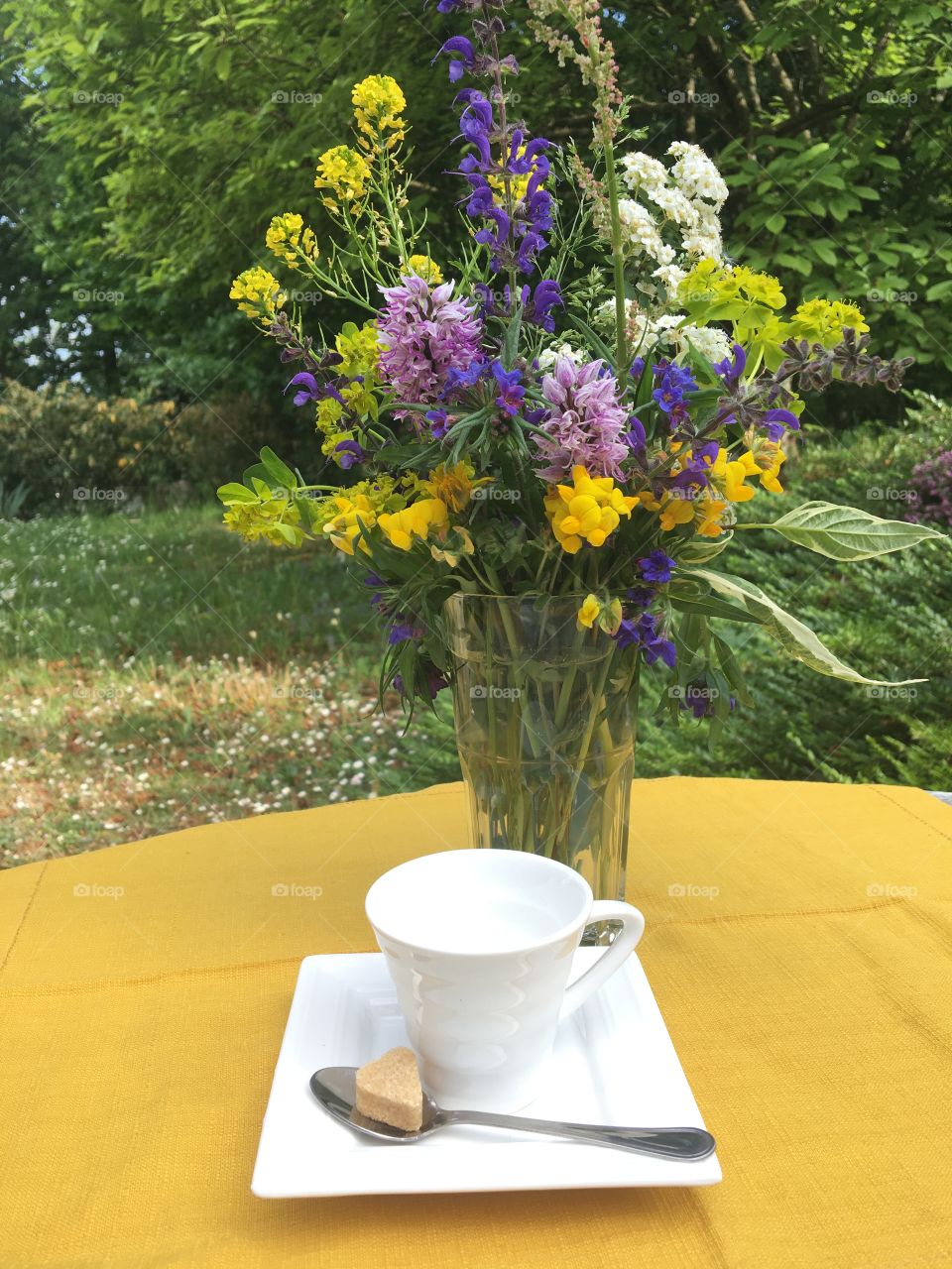 Preparing coffee time with a colorful bouquet 