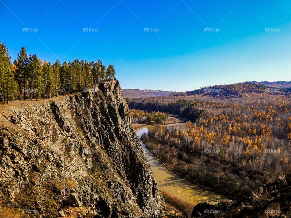 Rock of Love over the boundless sea of taiga. Uldurga river valley, Tungokochensky district, Transbaikalian territory, Siberia, Russia.