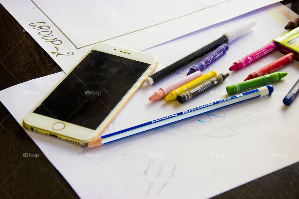 Smartphone on drawing table, white iphone