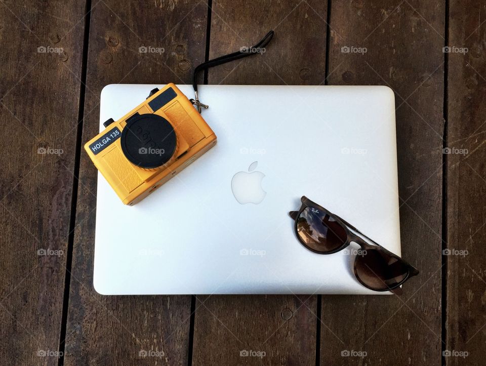 Camera and Laptop. Macbook, holga camera and glasses