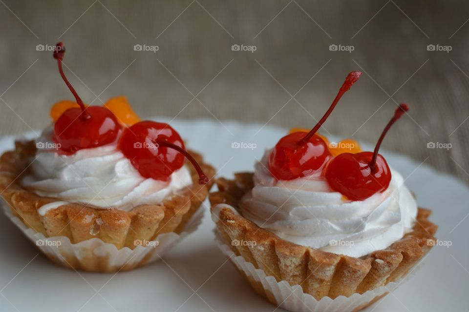 two cakes with cherry tasty food