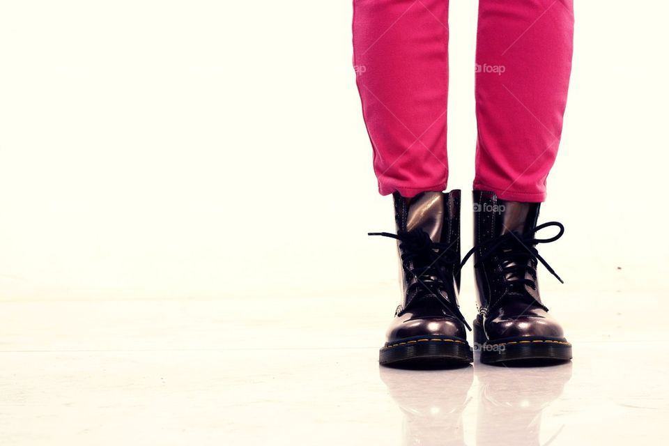 pink pants and shiny leather boots