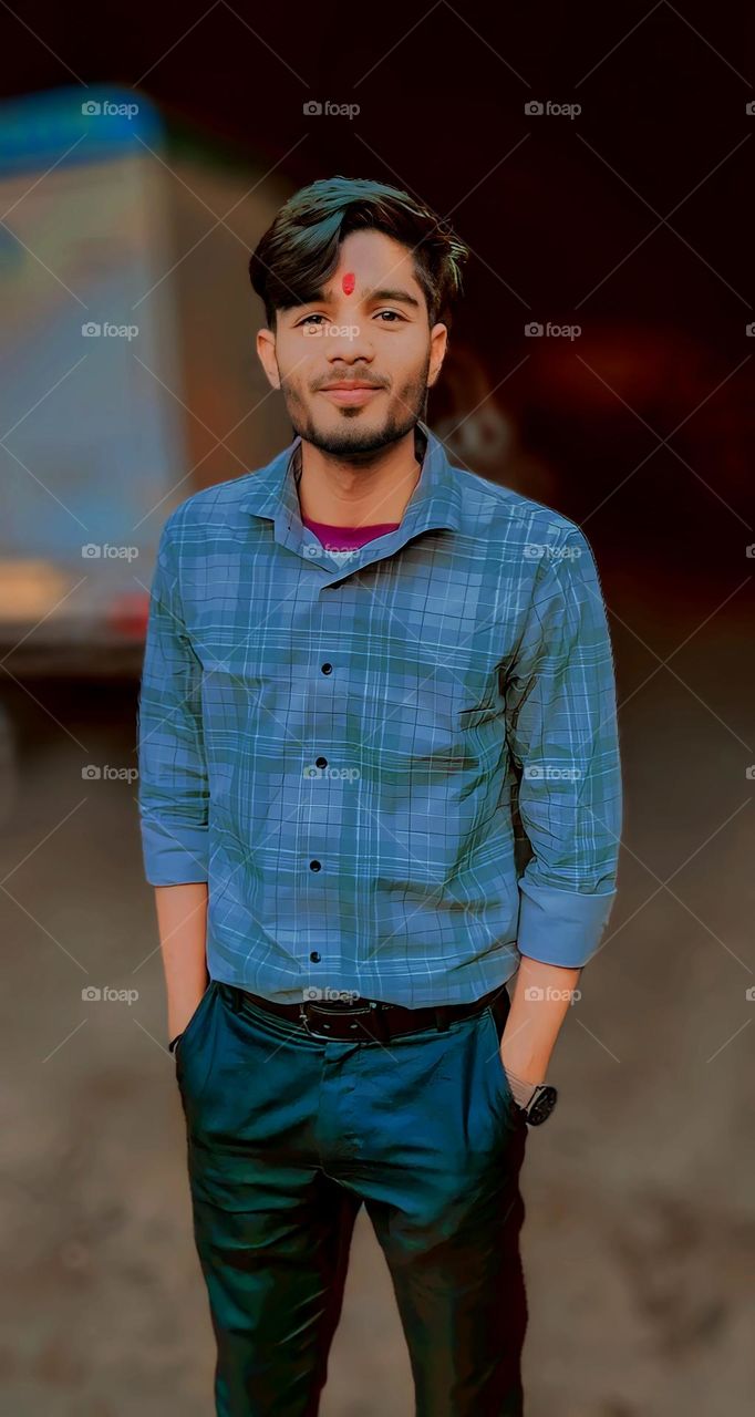 a portrait of a Indian boy with smile face