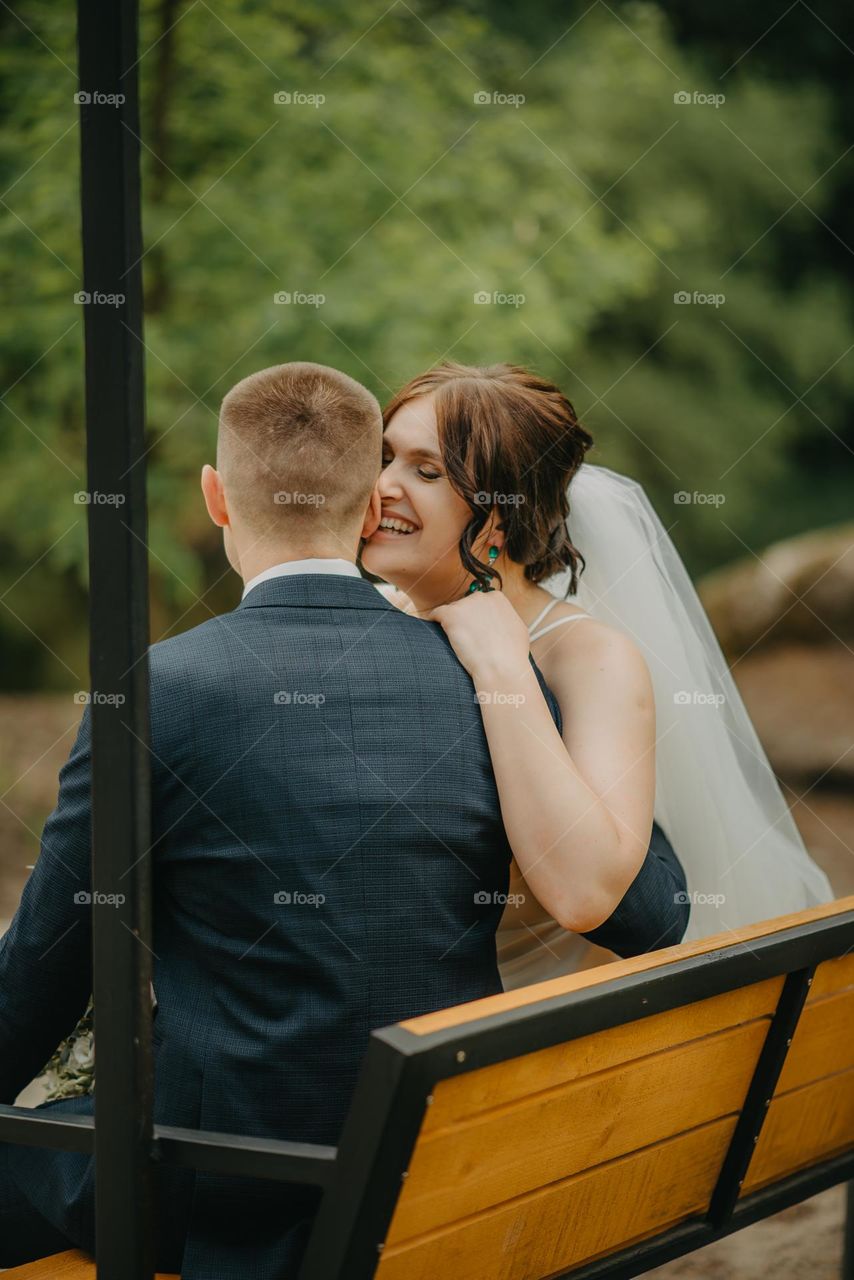 Happy bride and groom in the park